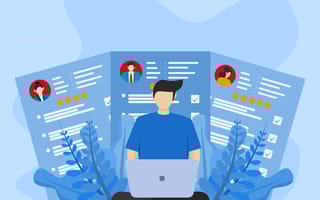 An illustration of three resumes behind a worker at a laptop