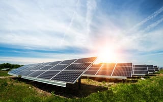 Solar panels have been installed in a field to capture sunlight and convert it into energy.