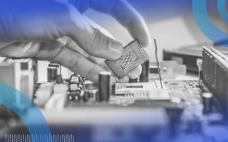 A hand places a microchip on a motherboard