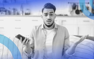 A person holding a phone and looking confused. Voice cloning copies human voices with alarming accuracy.
