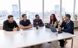 coworkers sitting around a table