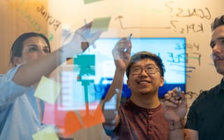 Orchard team members doing an illustration on a board