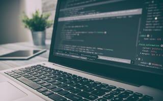 A computer with code on the screen.