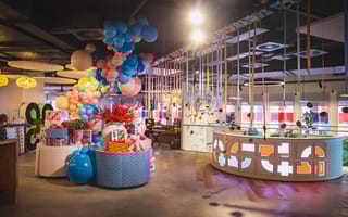Photo of balloons and streamers throughout Bringg’s office space.