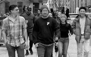 The Finch team walks down a city sidewalk.