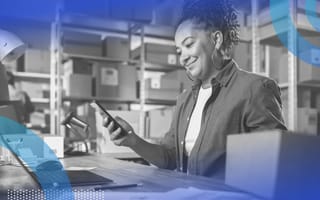 A small business owner completing a transaction. Get through tough times by spending smart, investing in technology and supporting employees.