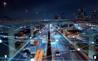 Photo of highway at night with overlay of logistical mapping of points