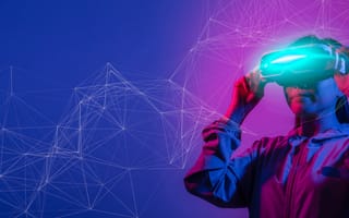 person wearing virtual reality headset in blue and purple lighting