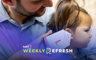 Someone places a smartphone next to a child's ear, using Wavely's infection diagnosis app.