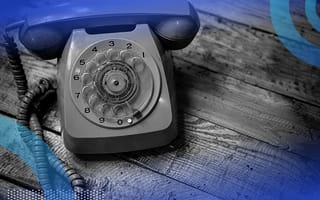 Rotary phone on a table representing API calls