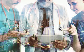 An artistic rendering of healthcare professionals poring over a tablet. An image of a cityscape is faintly overlaid.