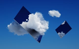 An abstract image of floating, rectangular mirrors. The mirrors float among clouds on a blue background.