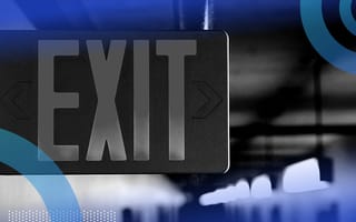exit sign in a hallway leading to exit