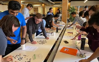 Cohere Health team members work on a group puzzle.