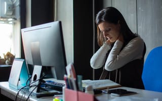 Fatigued woman at computer
