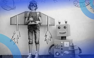 Why AI Is a Friend, Not a Foe, to Today’s Workers A child wearing cardboard wings and aviator goggles stands next to a smiling cardboard robot