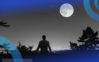 A person sitting in moonlight. Moonlighting helps employees make extra money and fulfill their dreams.