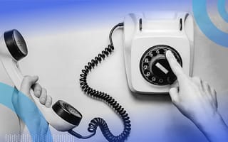 Person dialing a number on a rotary phone