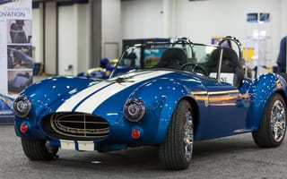 A two-door blue convertible car