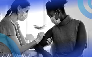 A nurse/doctor giving a woman a vaccine in her arm.