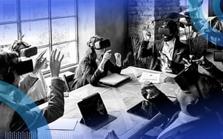 A group of business people using VR headsets in a meeting.