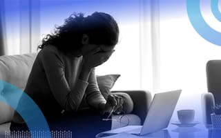 A remote worker with her head in her hands.