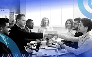 business people shaking hands across a table