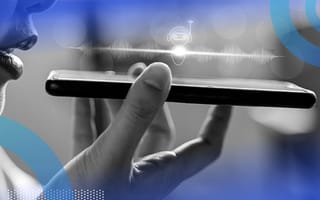 Person speaking into their phone using voice tech