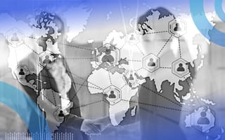 A global map with tokens at major cities overlaid above businesspeople shaking hands