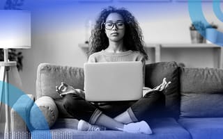 A person meditating while working from home. Meditating calms your mind and helps you focus on your work.