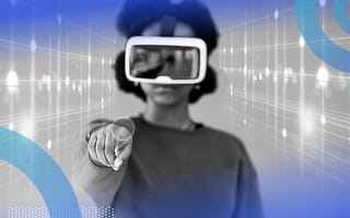 A woman wearing a VR headset pointing toward the camera as though interacting with a screen.