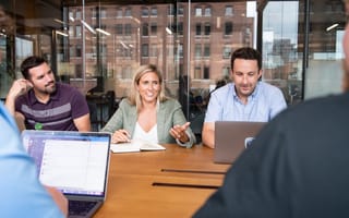 Team members meet to discuss a project.