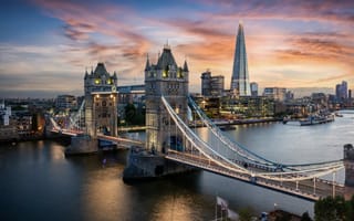 An aerial view of the Tower Bridge and London skyline.