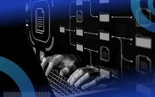 A close-up of hands typing on a computer with a data management overlay