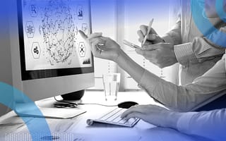 Two data scientists creating a machine learning model on computer