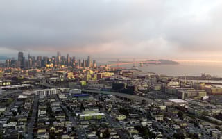 An aerial photo of the San Francisco Mission Bay neighborhood is shown.