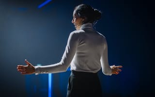 A tech leader gives a speech onstage.
