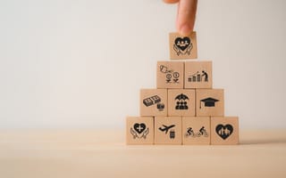 A stack of blocks depicting employee benefits.