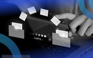 Holographic files moving in an arc from one folder to another over a laptop with a finger pointing at it in the background.