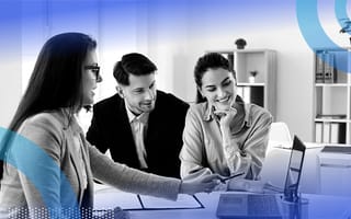 Three businesspeople negotiating a deal.