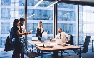 finance professionals talking in an office