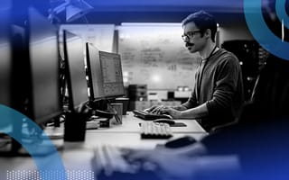 A computer engineer works at a terminal