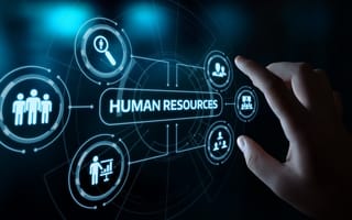 A hand touching a screen that reads 'Human Resources'