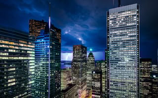 The Toronto skyline is pictured at night.
