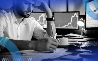 An employee concentrating and working at a desk.