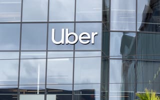 An exterior photo of Uber's office is shown.