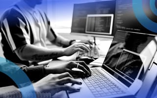 Two developers running a test on monitors