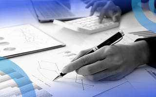 Why 1.5 Is Used in the IQR Rule for Outlier Detection Close up of a data analyst reviewing statistics with a pen and calculator