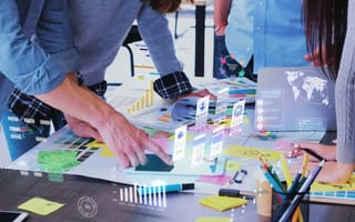 Marketing team looks over notes.