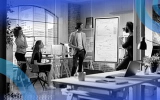 Marketing team brainstorming around whiteboard